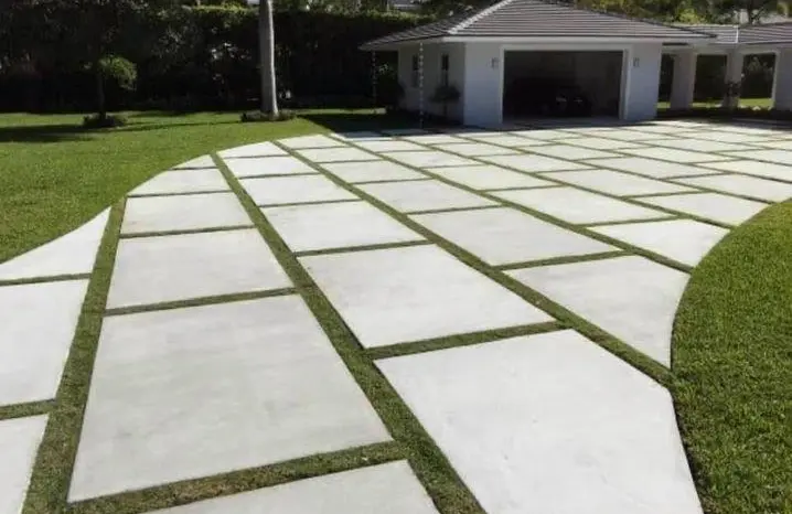 Modern concrete driveway with decorative grass joints